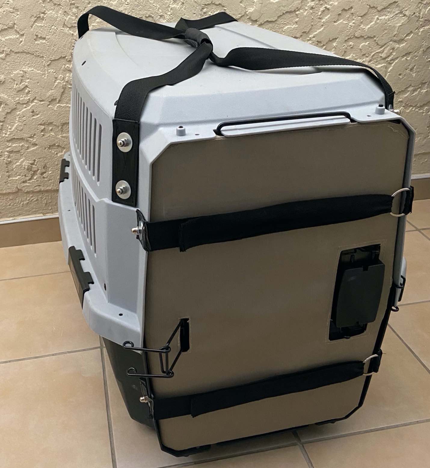 A grey plastic animal carrying crate