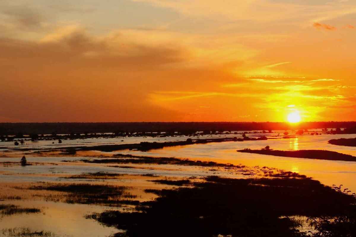 The sun setting over the Okavango River.