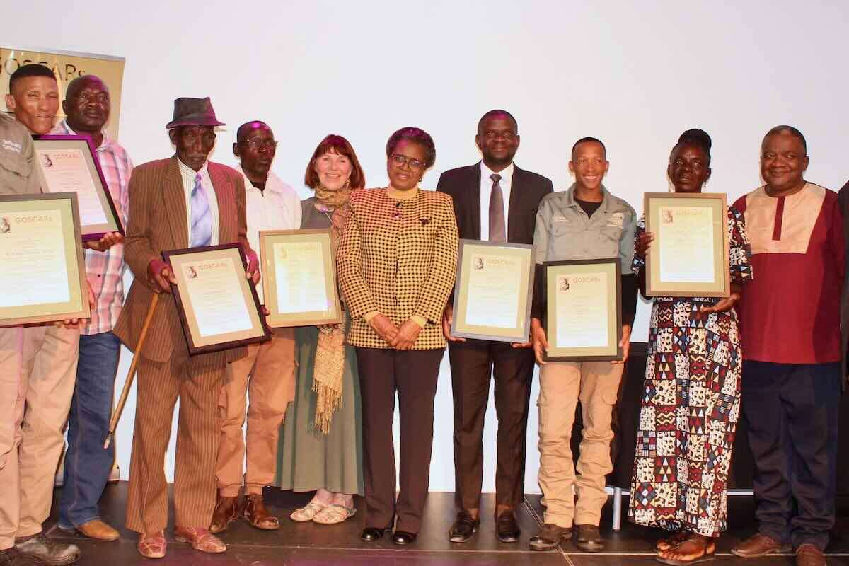 The GOSCAR winners pose for a photo with Margaret Jacobsohn and the Hon. Indileni Daniel.