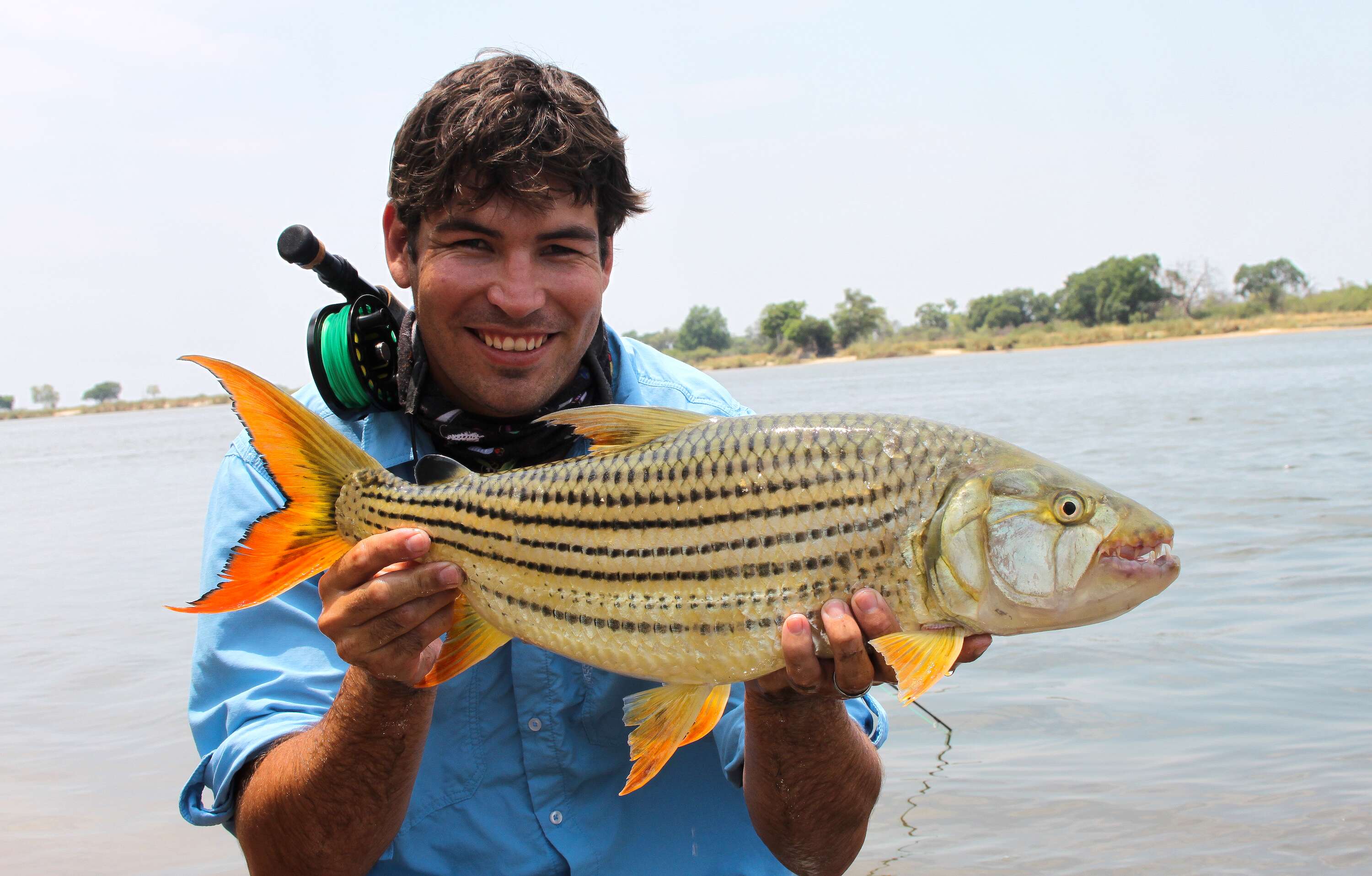 A happy fisherman with his fish.
