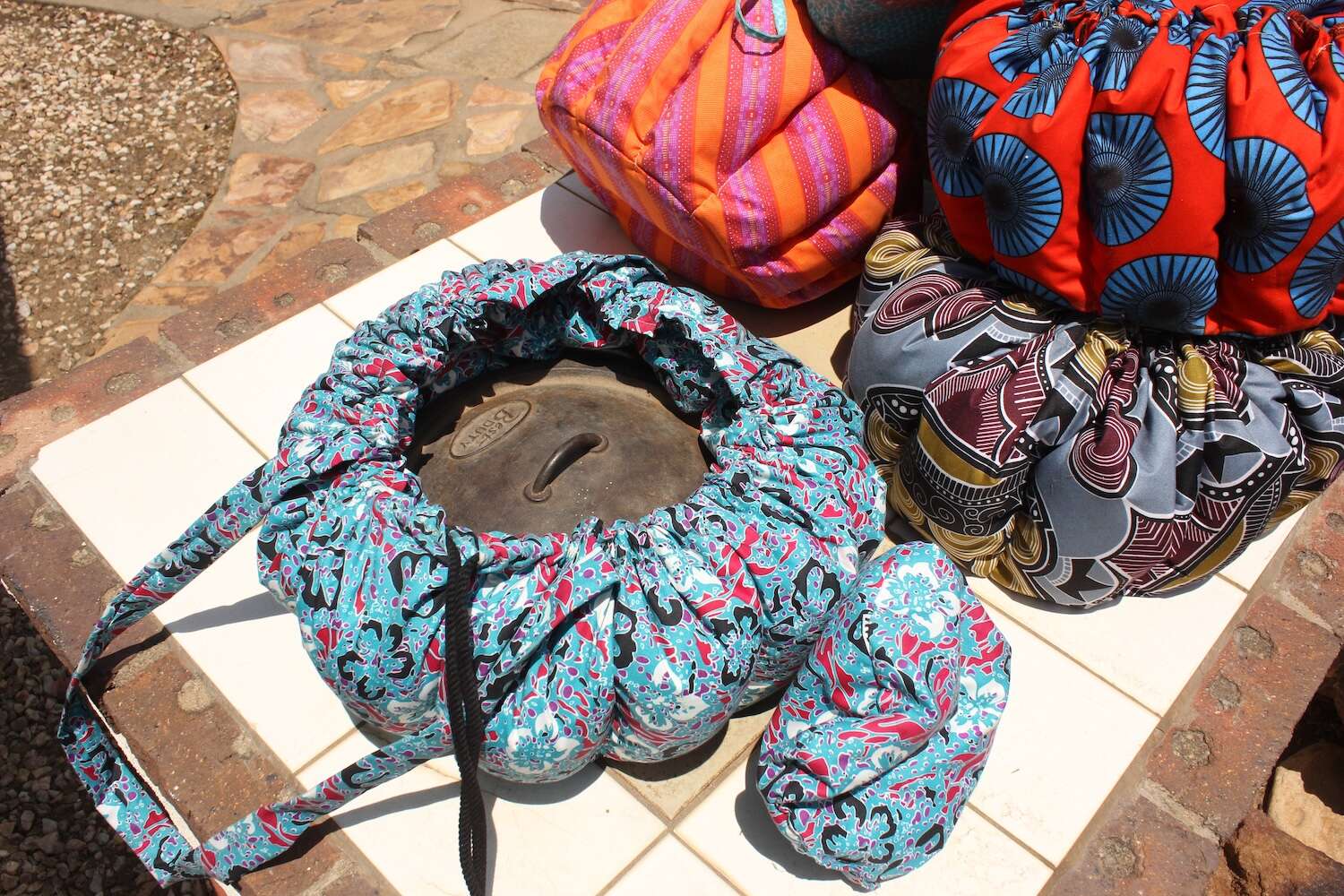 An open Namibag showing an iron cooking pot within.