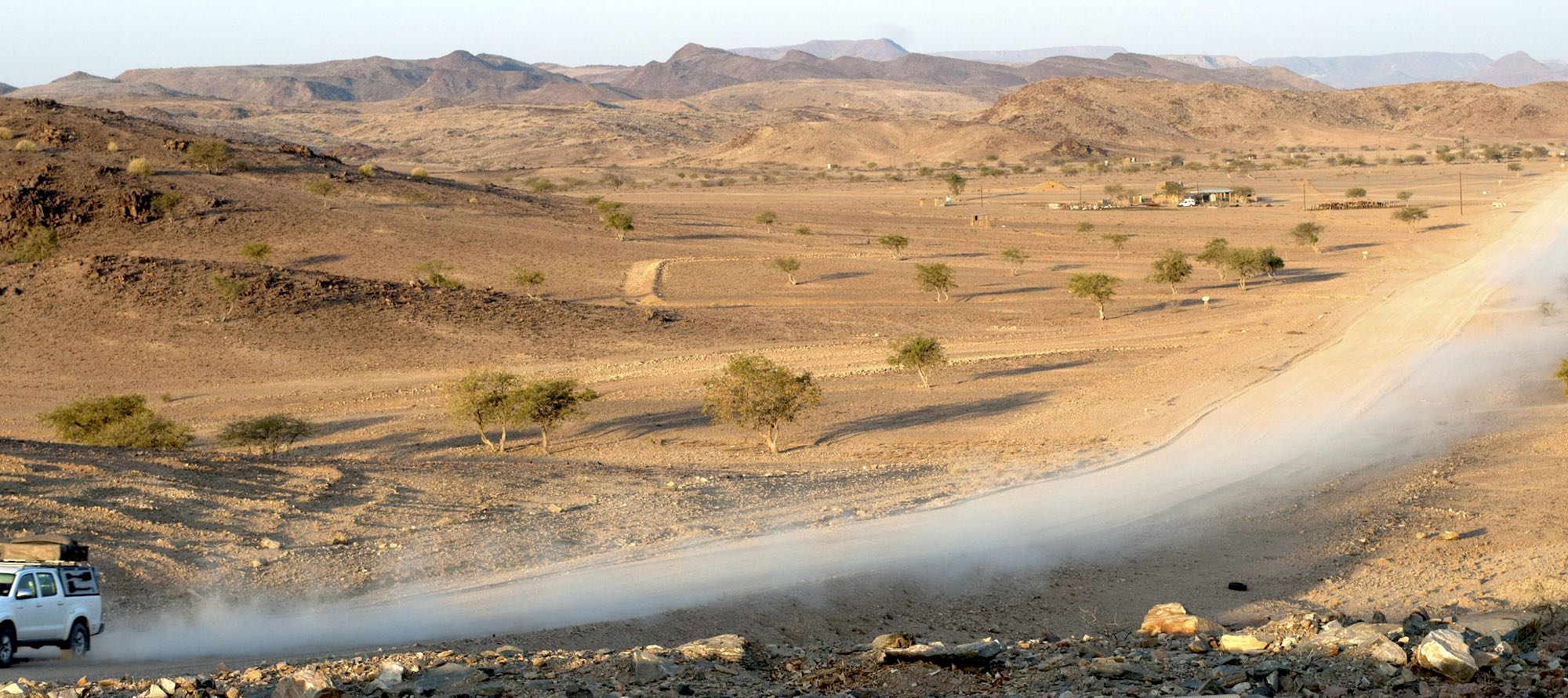 a tourist drives through a conservancy