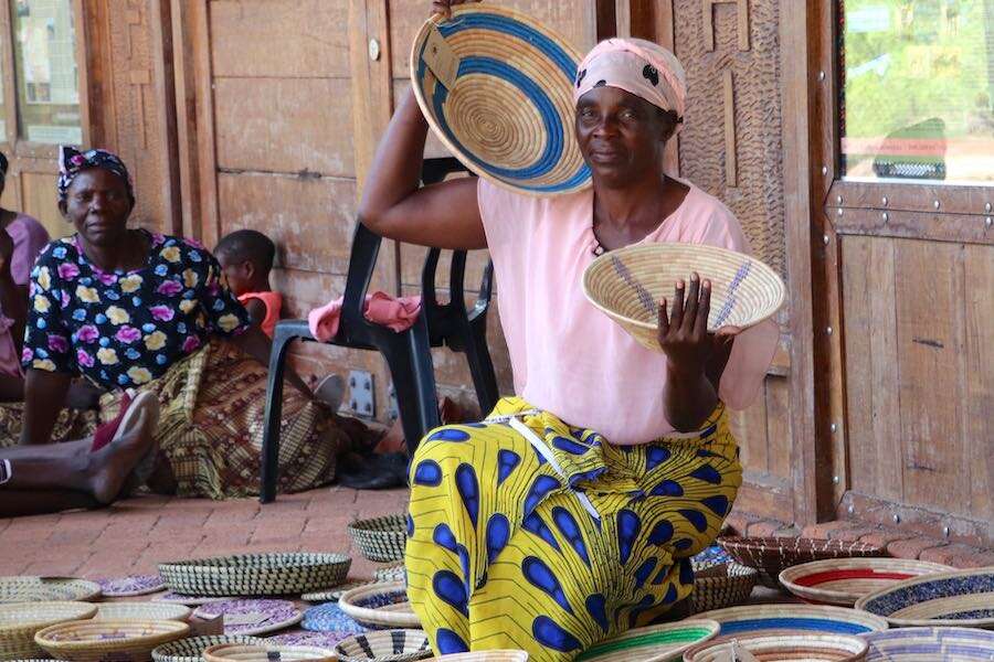 A woman crafter and her baskets.